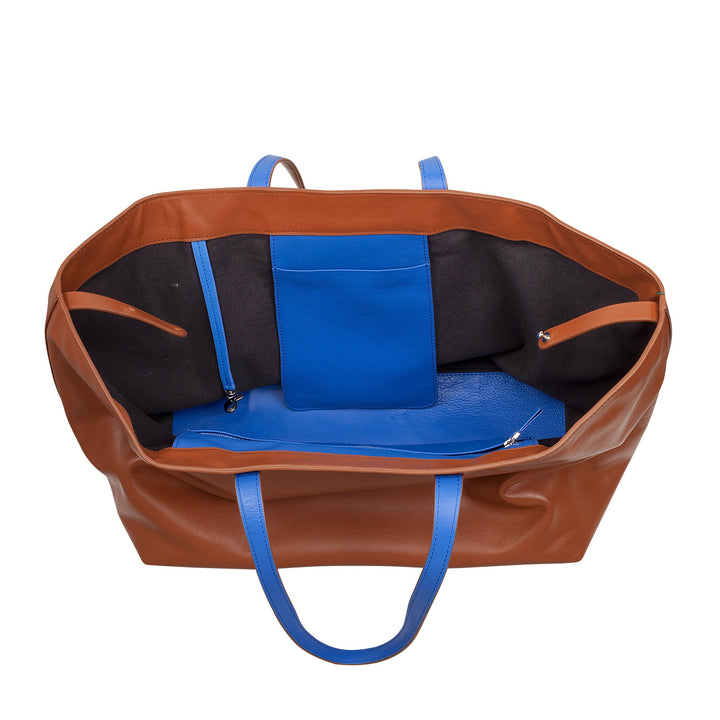 Open brown leather tote bag with blue interior pockets and black lining