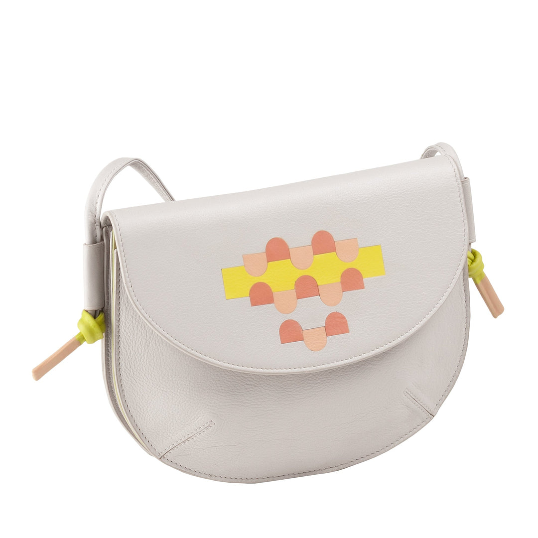 White leather handbag with colorful geometric design and adjustable strap