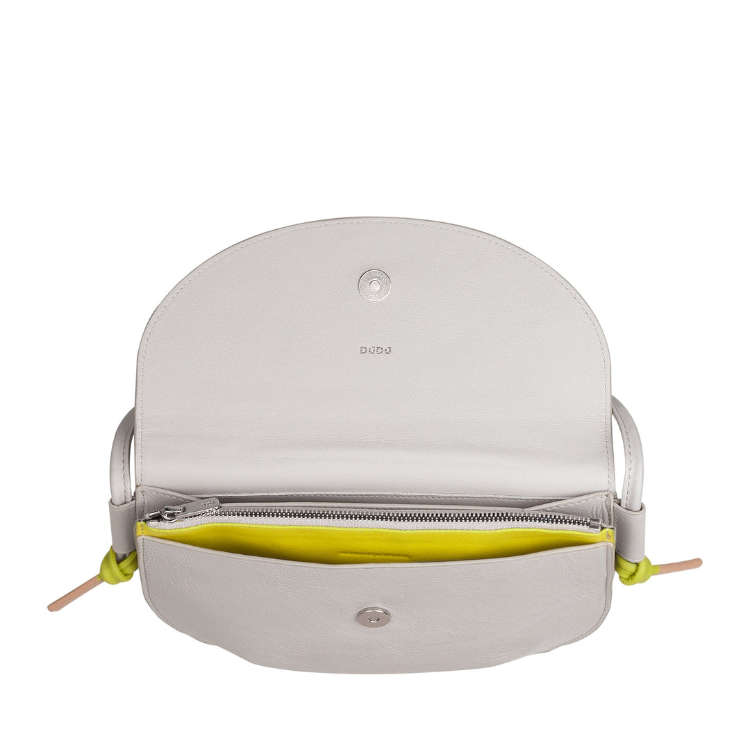 Open white leather handbag showcasing interior with zipper compartment and yellow lining