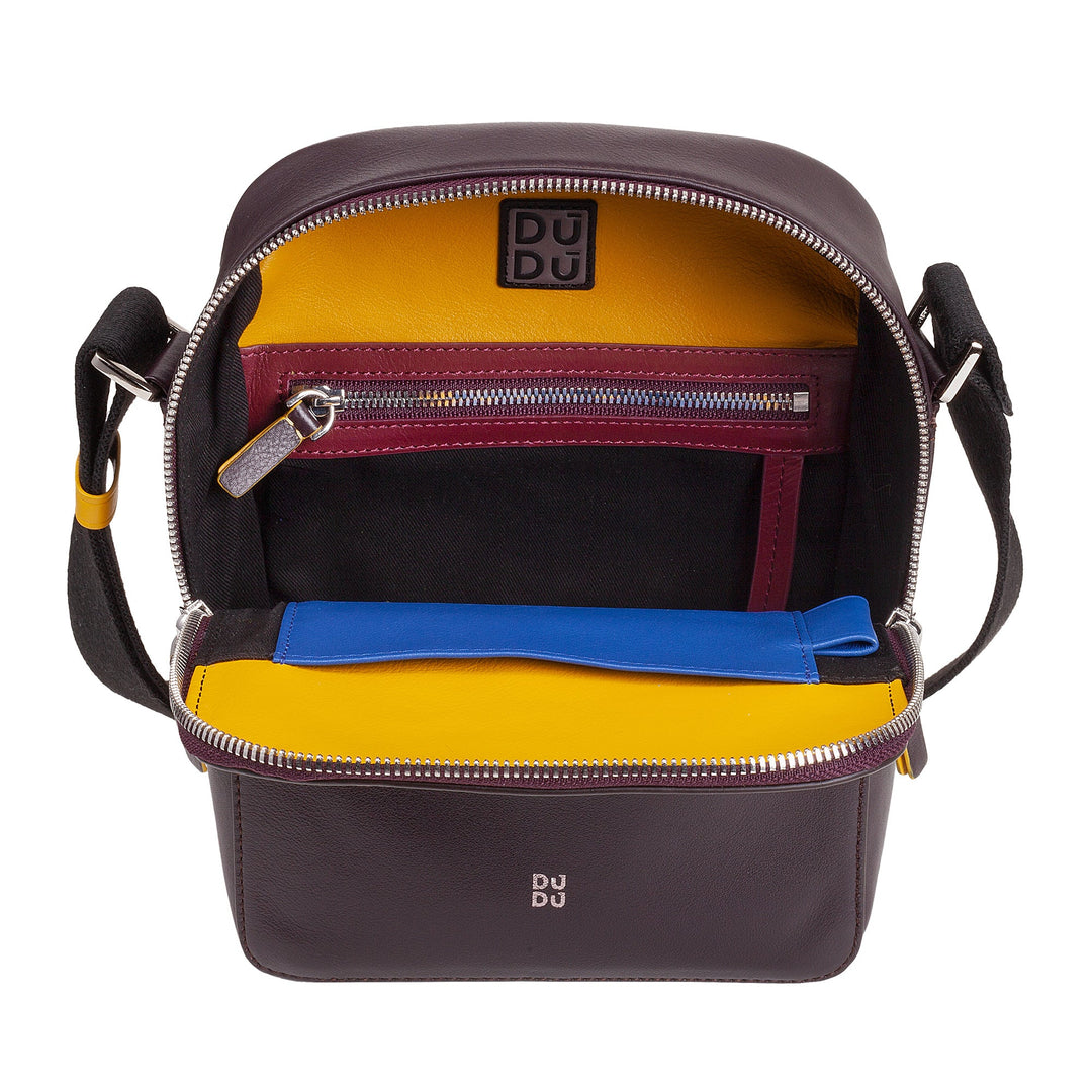 Colorful leather crossbody bag with multiple compartments, zippers, and adjustable strap