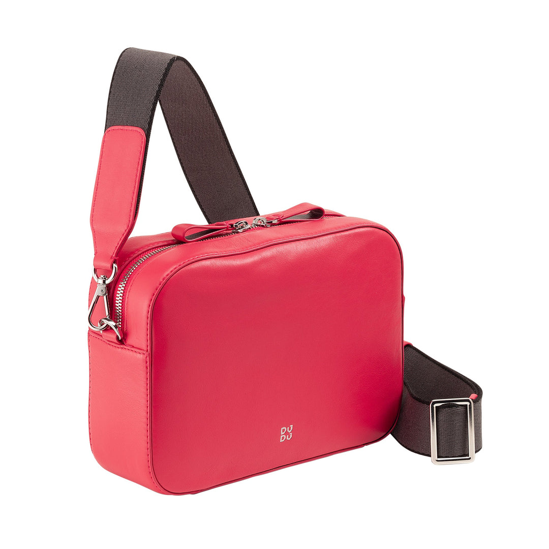 Red leather crossbody bag with a black adjustable shoulder strap and silver hardware