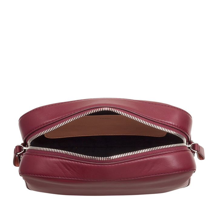 Maroon leather zippered bag opened, showing interior