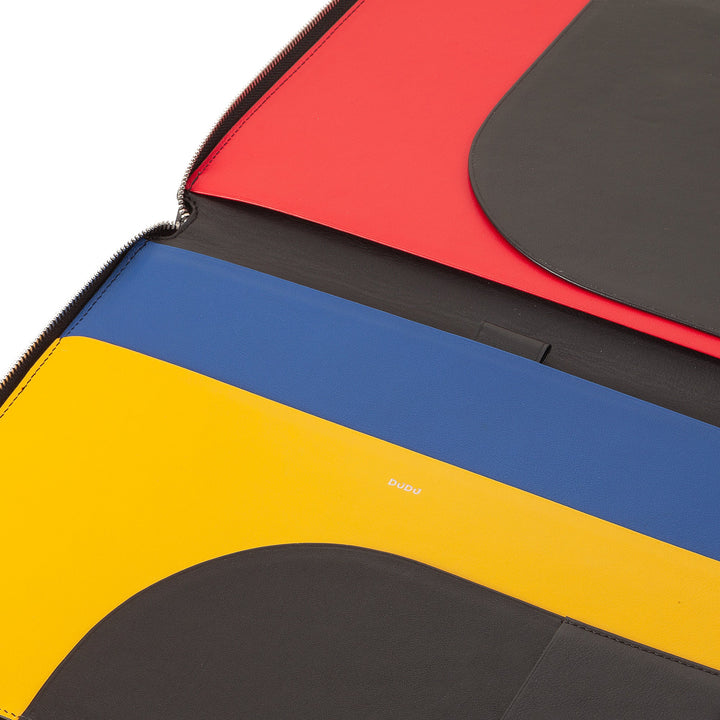 Close-up of colorful leather document folder with multiple compartments in red, blue, yellow, and black