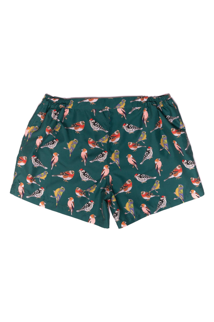 Green shorts with colorful bird print design