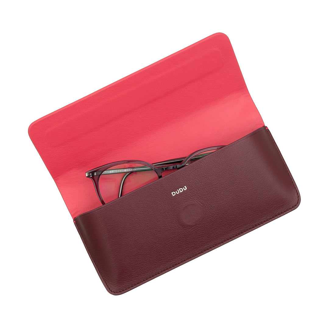 Open red and maroon leather glasses case holding a pair of eyeglasses