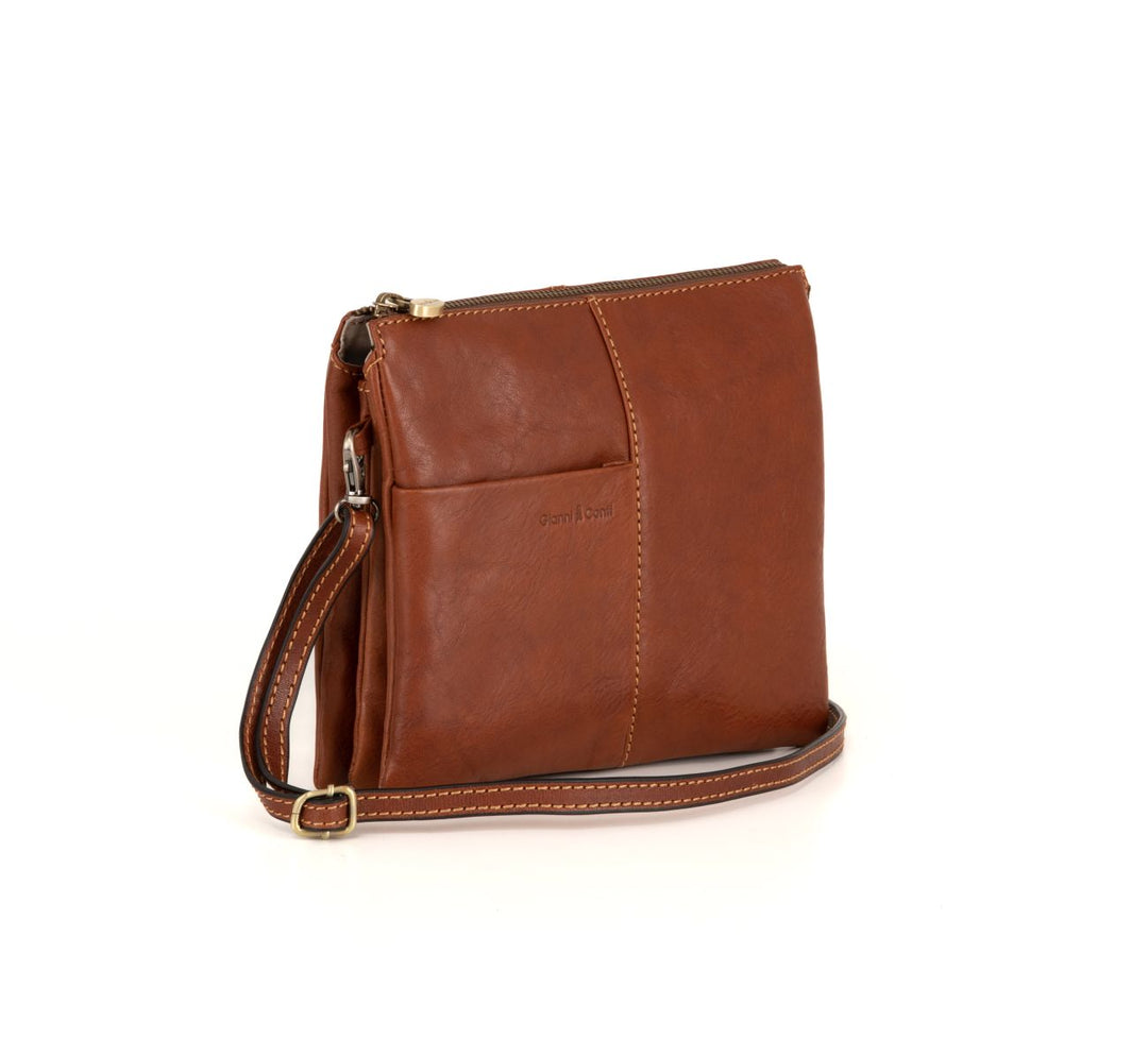 Brown leather crossbody handbag with adjustable strap on a white background