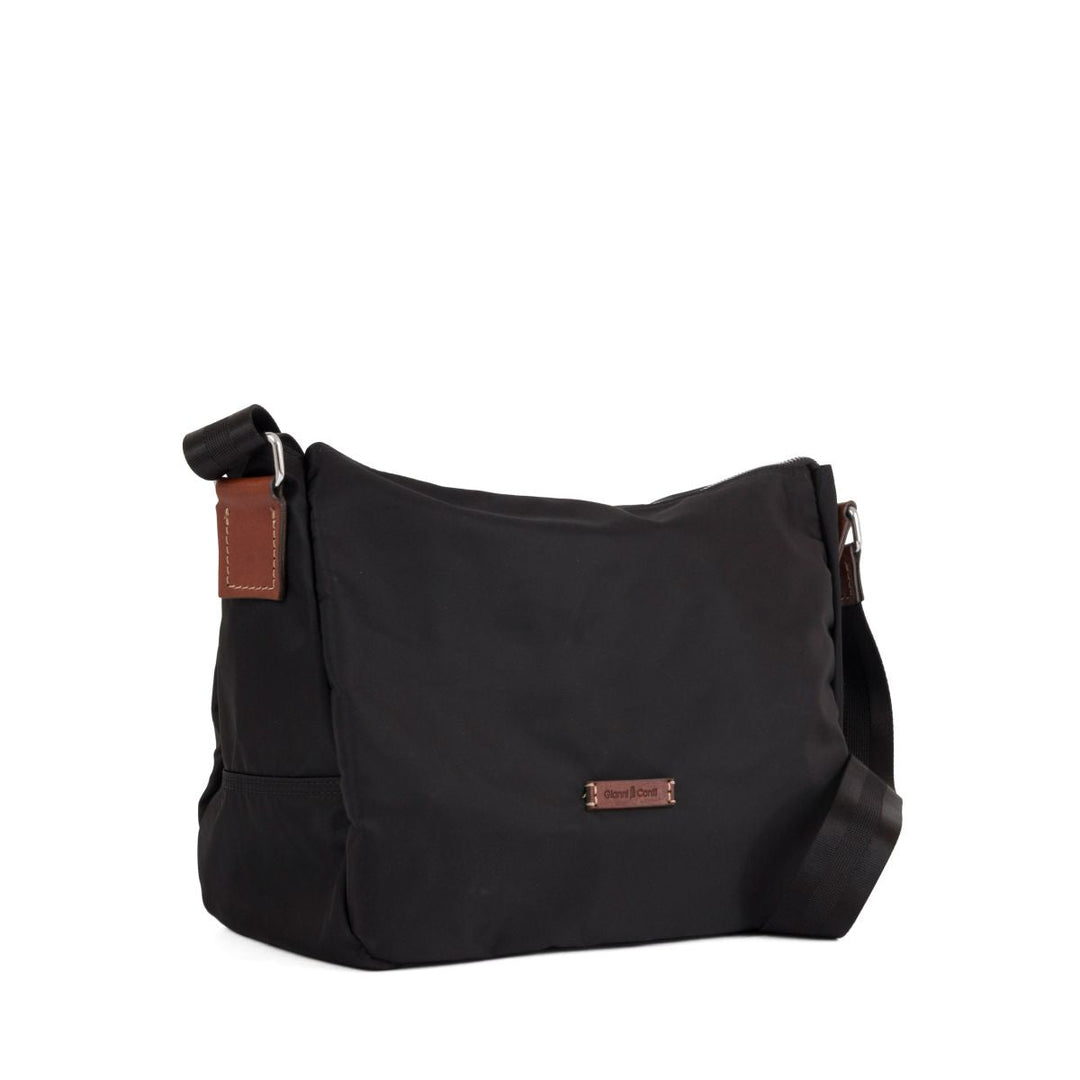 Black crossbody bag with adjustable strap and leather accents