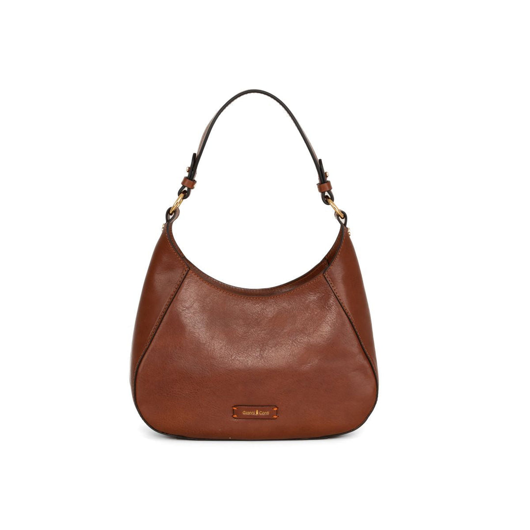 Brown leather shoulder bag with a curved design and a single strap