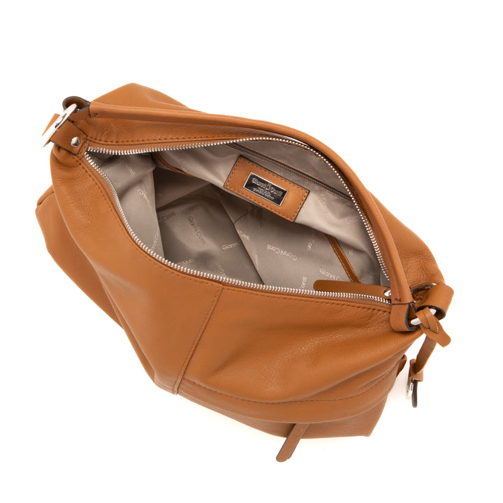 Open brown leather handbag with light grey inner lining and visible inner pockets