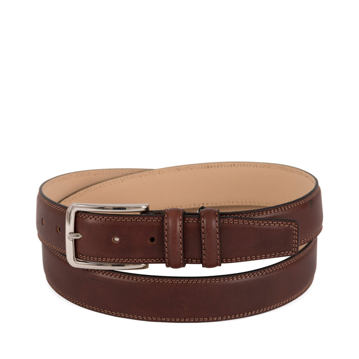 Brown leather belt with silver buckle on white background