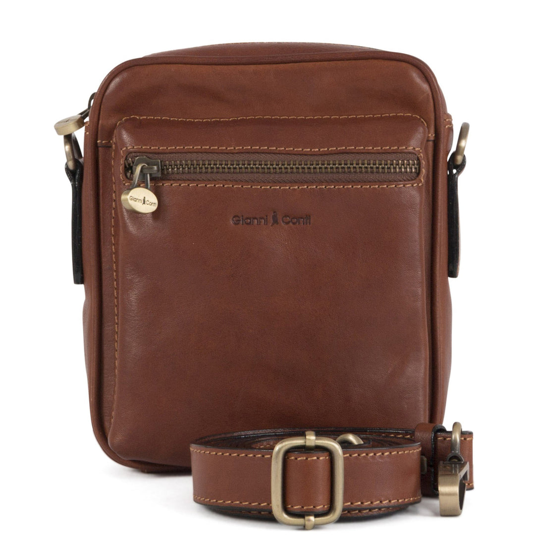 Brown leather crossbody bag with zipper compartments and adjustable strap