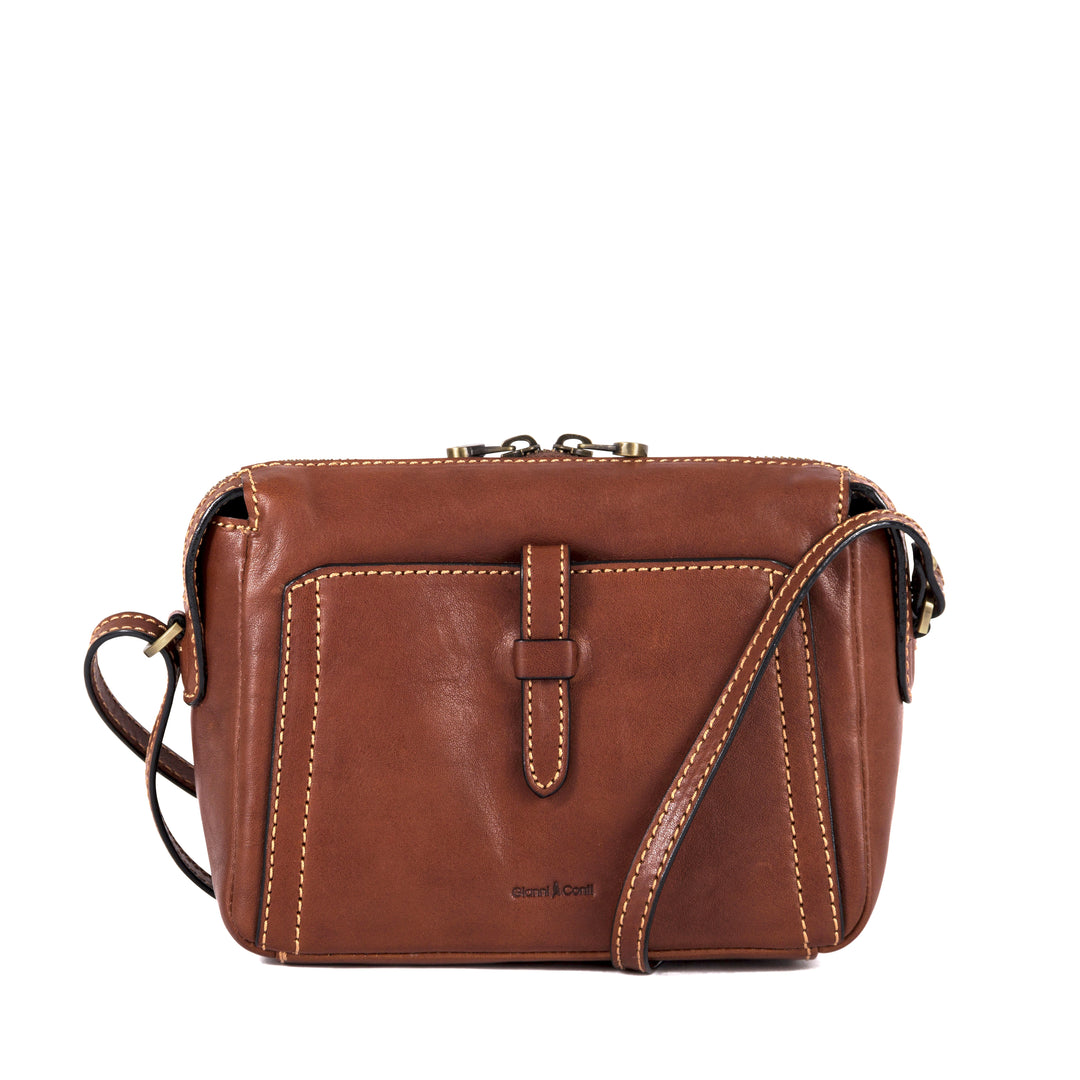 Brown leather crossbody handbag with front pocket and adjustable strap