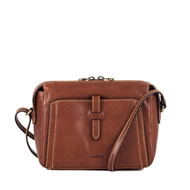 Brown leather crossbody handbag with front pocket and adjustable strap