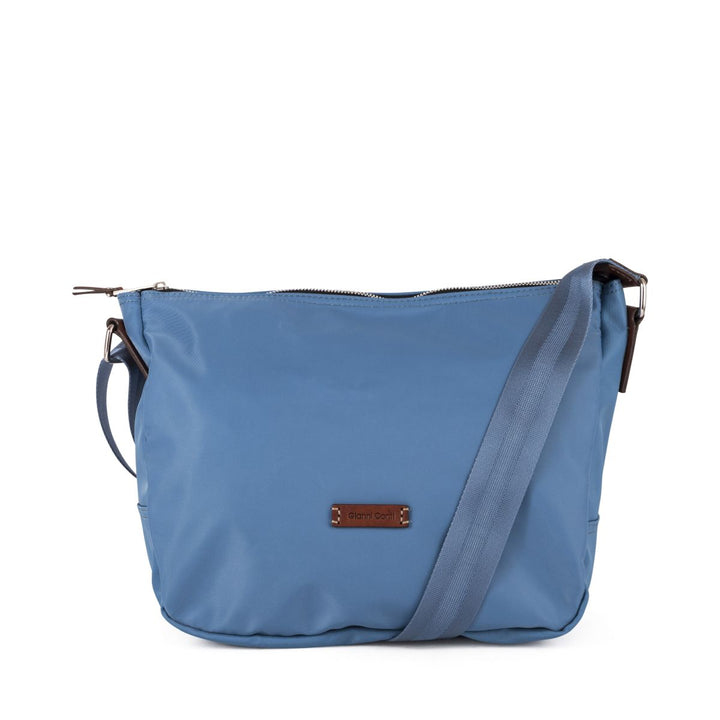 Light blue crossbody bag with adjustable strap and front brand logo