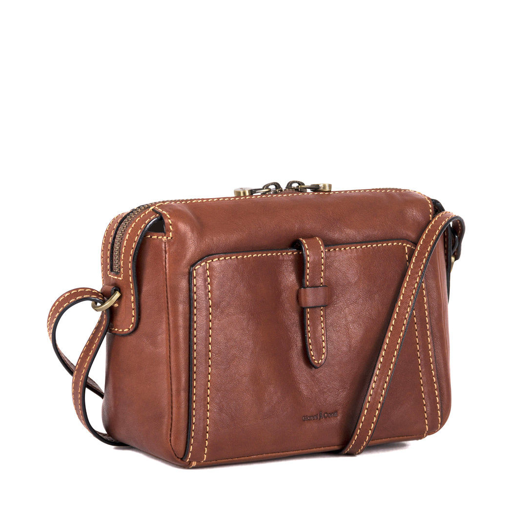 Brown leather crossbody bag with front pocket and adjustable strap