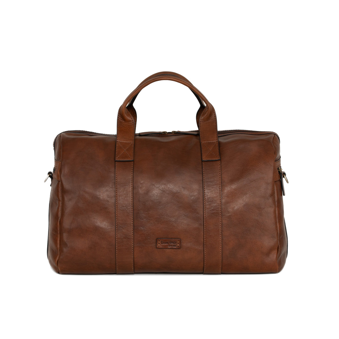 Brown leather duffle bag with top handles and a front logo