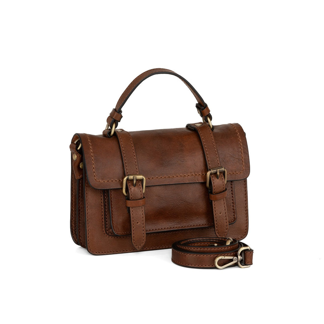 Brown leather satchel handbag with adjustable strap and buckle accents