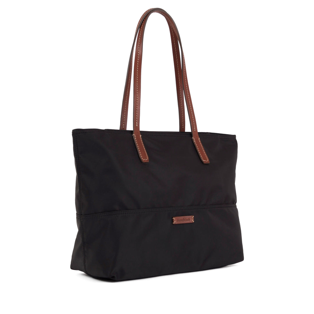 Black tote bag with brown leather handles and a front pocket