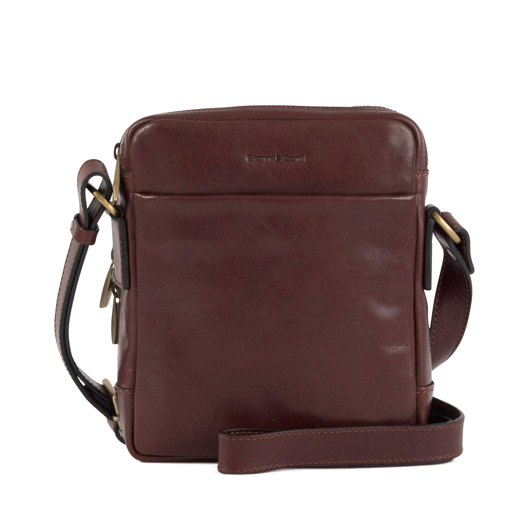 Dark brown leather crossbody bag with front pocket and adjustable strap