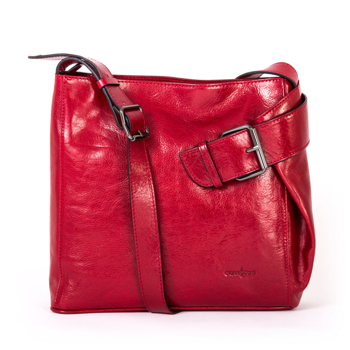 Red leather crossbody bag with adjustable strap and buckle detail