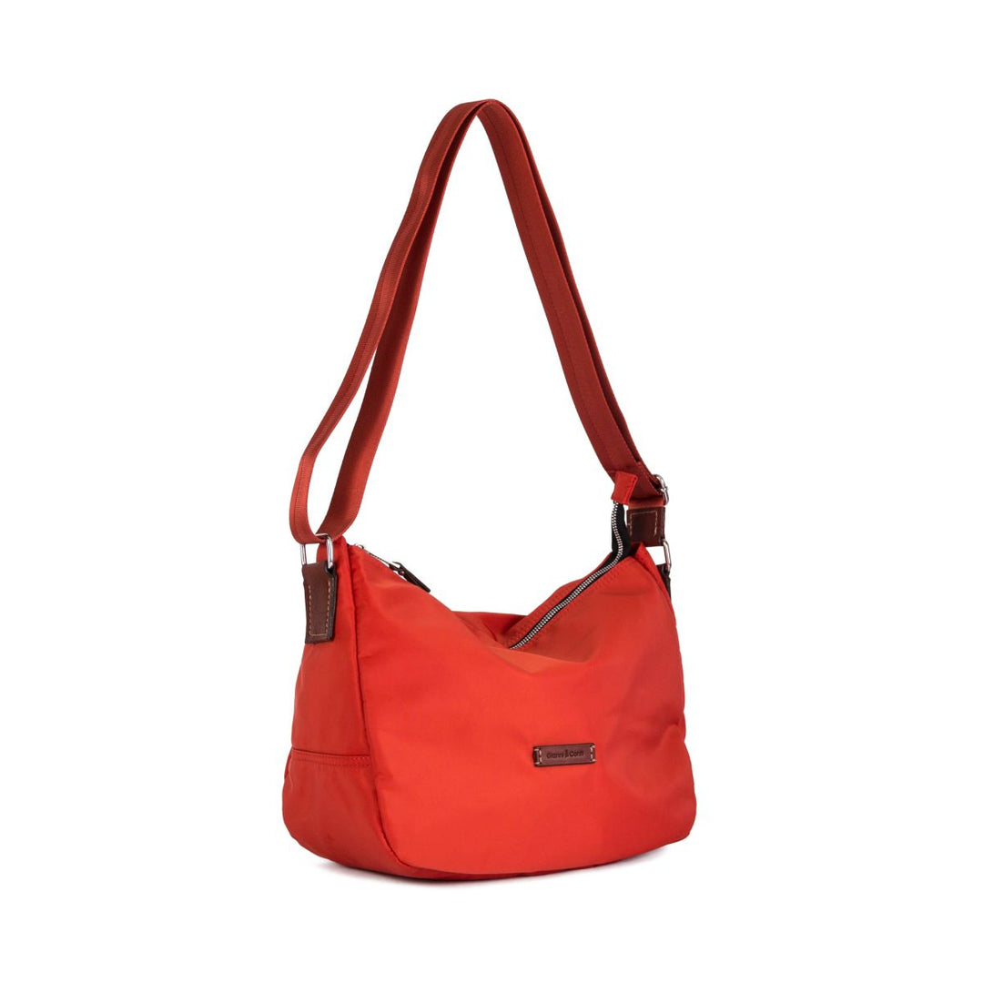 Red shoulder bag with adjustable strap and zip closure