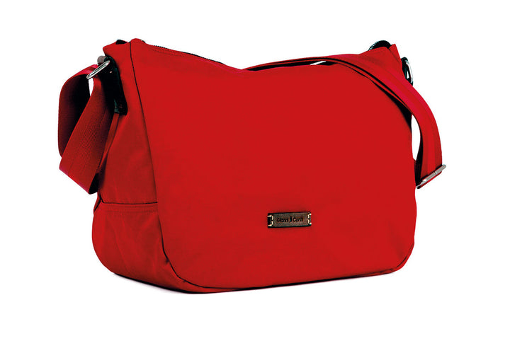 Bright red shoulder bag with adjustable strap and metal brand plaque on the front