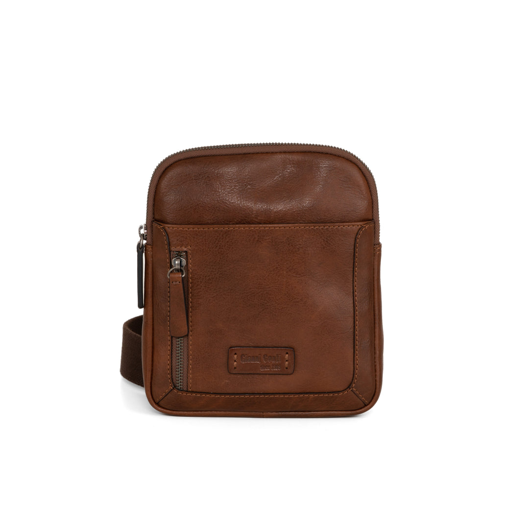 Brown leather crossbody bag with front pocket and zipper