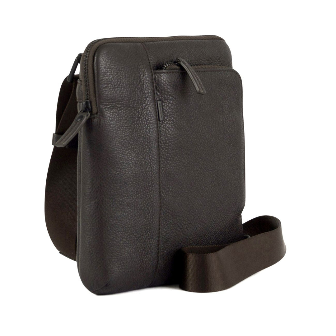 Dark brown leather crossbody bag with textured finish and adjustable strap