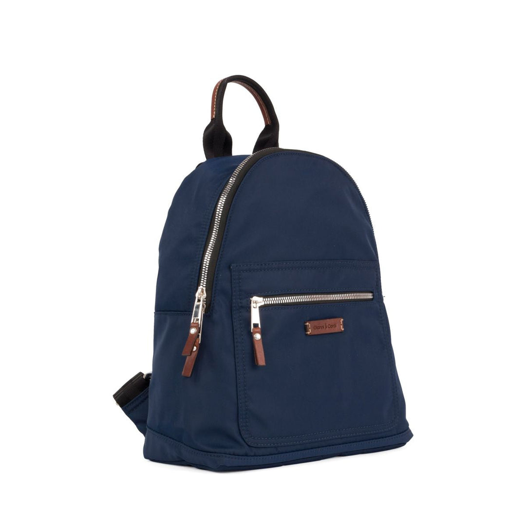 Small navy blue backpack with front zippered pocket and leather accents