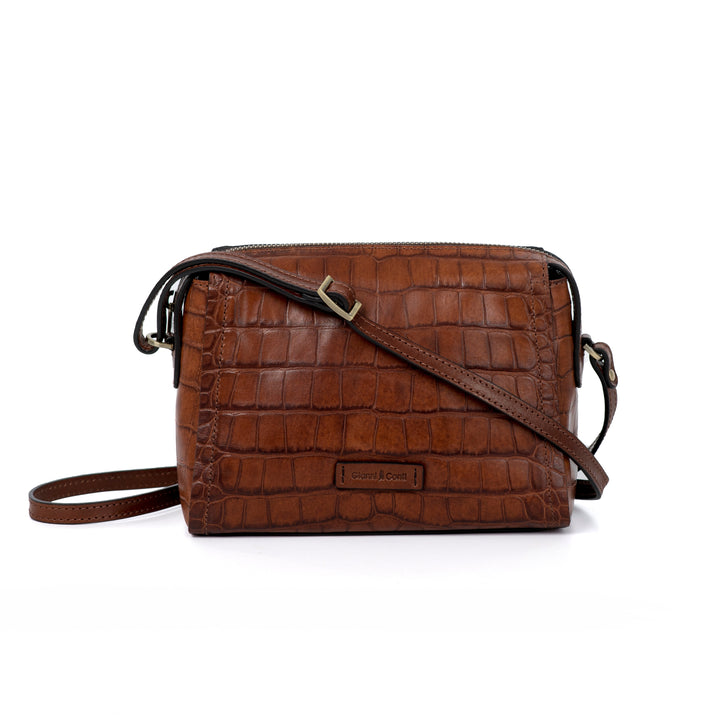 Brown leather crossbody handbag with crocodile texture and adjustable strap