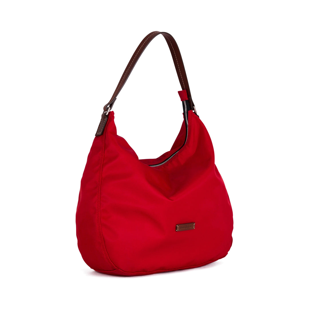 Red hobo handbag with brown leather strap and metal accent