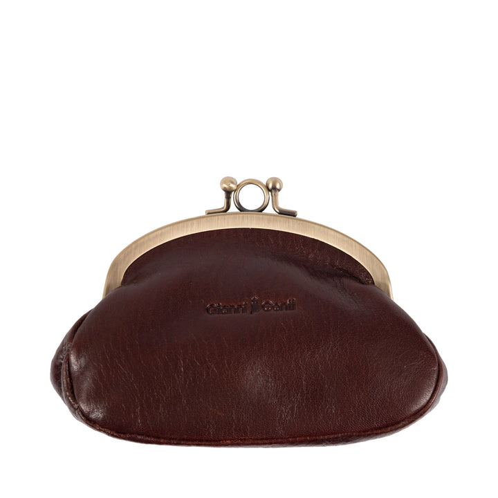 Close-up of a vintage brown leather coin purse with brass clasp