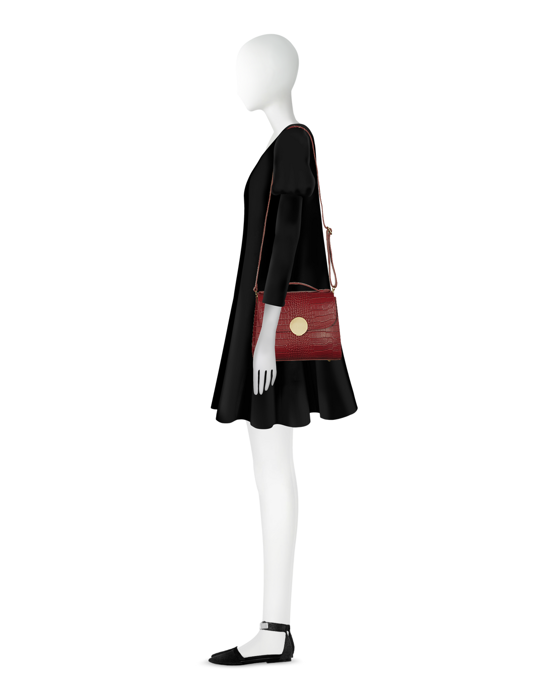 Mannequin wearing a black dress with a red leather shoulder bag