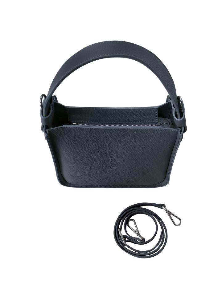 Dark blue leather handbag with detachable strap and zipper closure