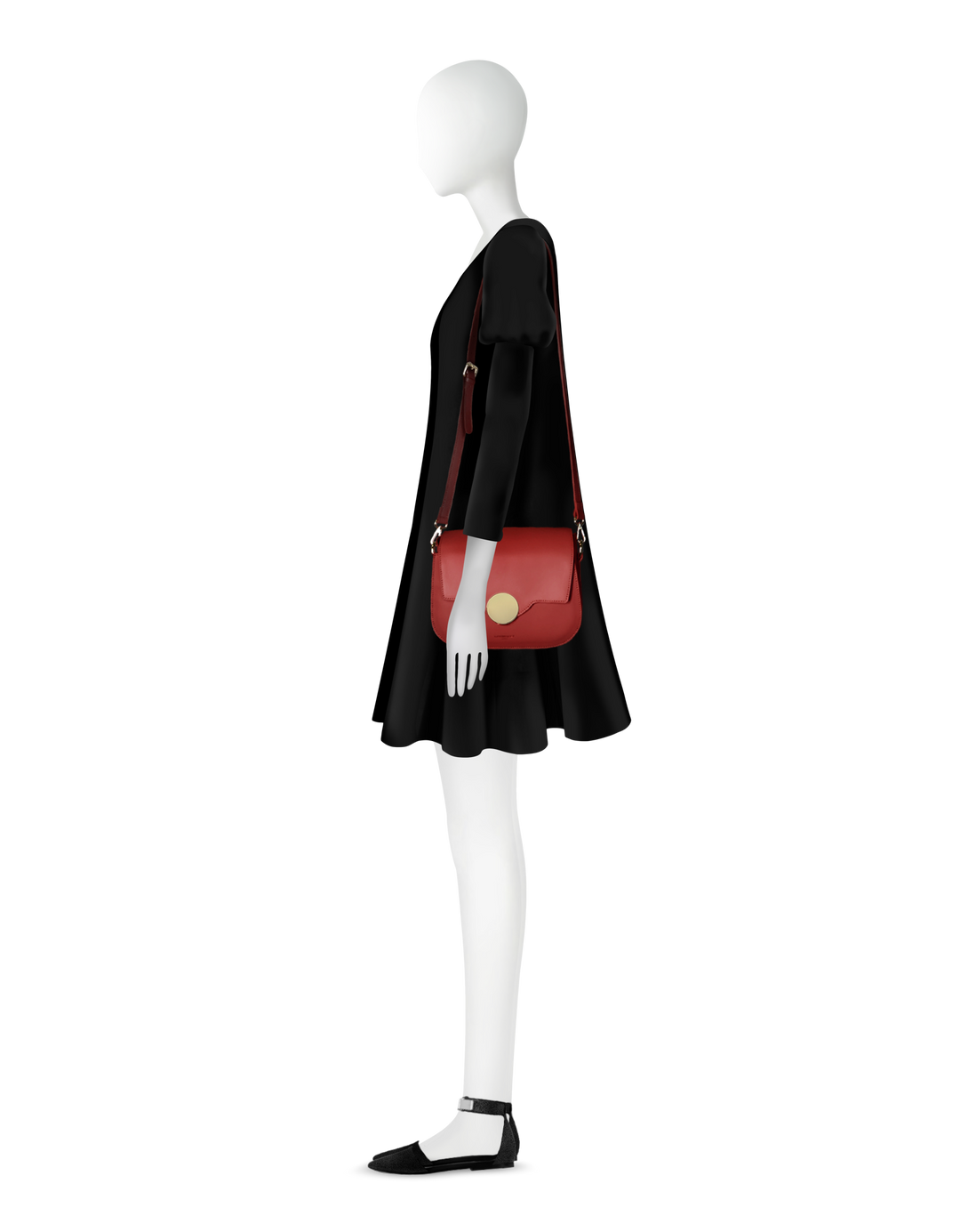 Stylish woman mannequin wearing black dress with red shoulder bag