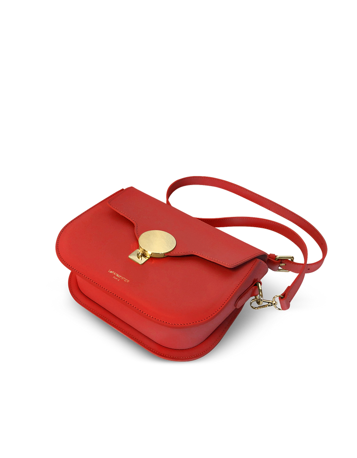 Red leather shoulder bag with gold clasp and adjustable strap