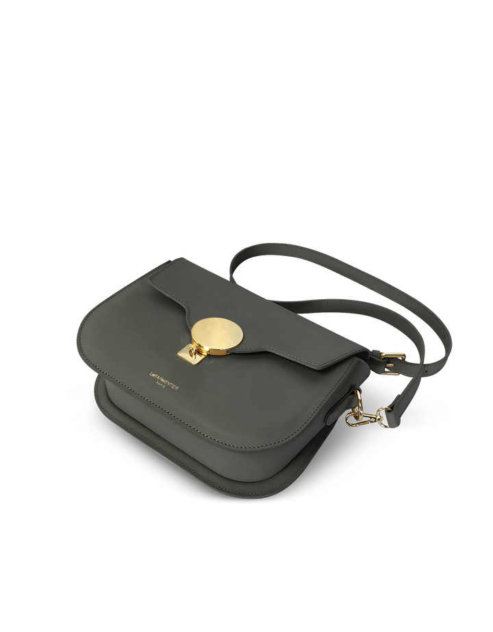 Gray leather crossbody bag with gold clasp and adjustable strap