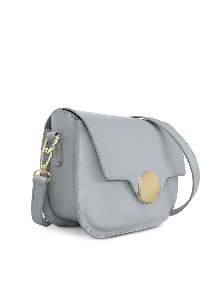 Light gray leather crossbody handbag with gold clasp and buckle