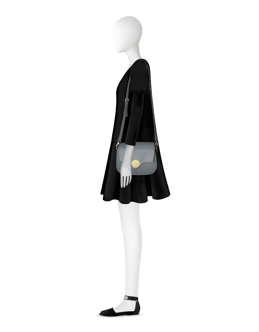 Mannequin in black dress wearing a shoulder bag