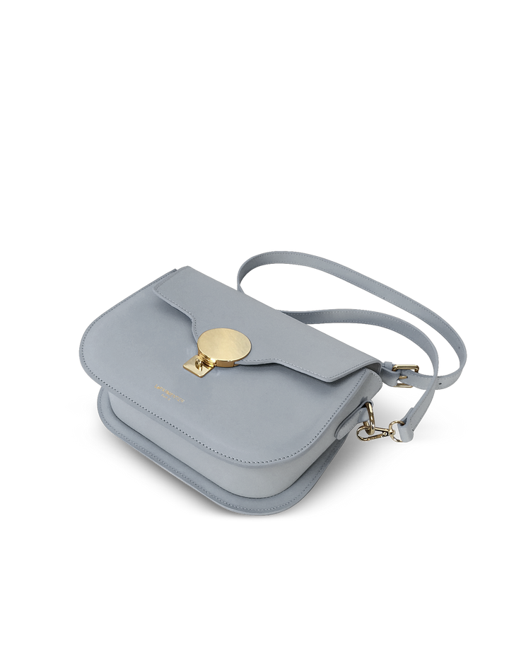 Light blue leather shoulder bag with gold buckle detail and adjustable strap