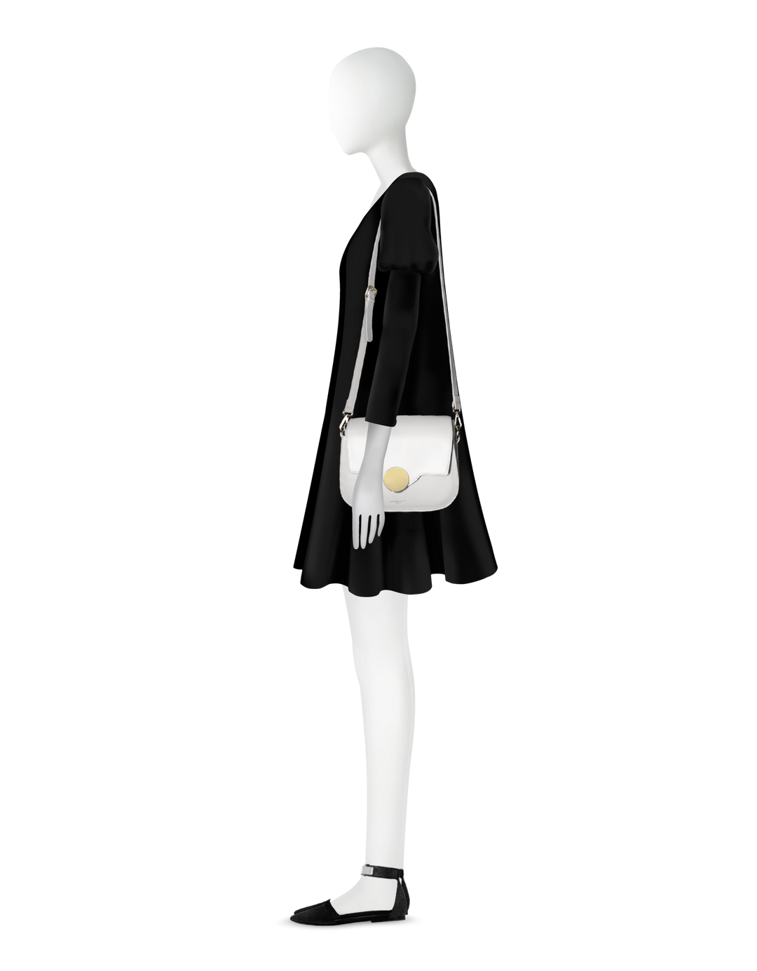 Mannequin wearing a black dress with a white handbag and black shoes