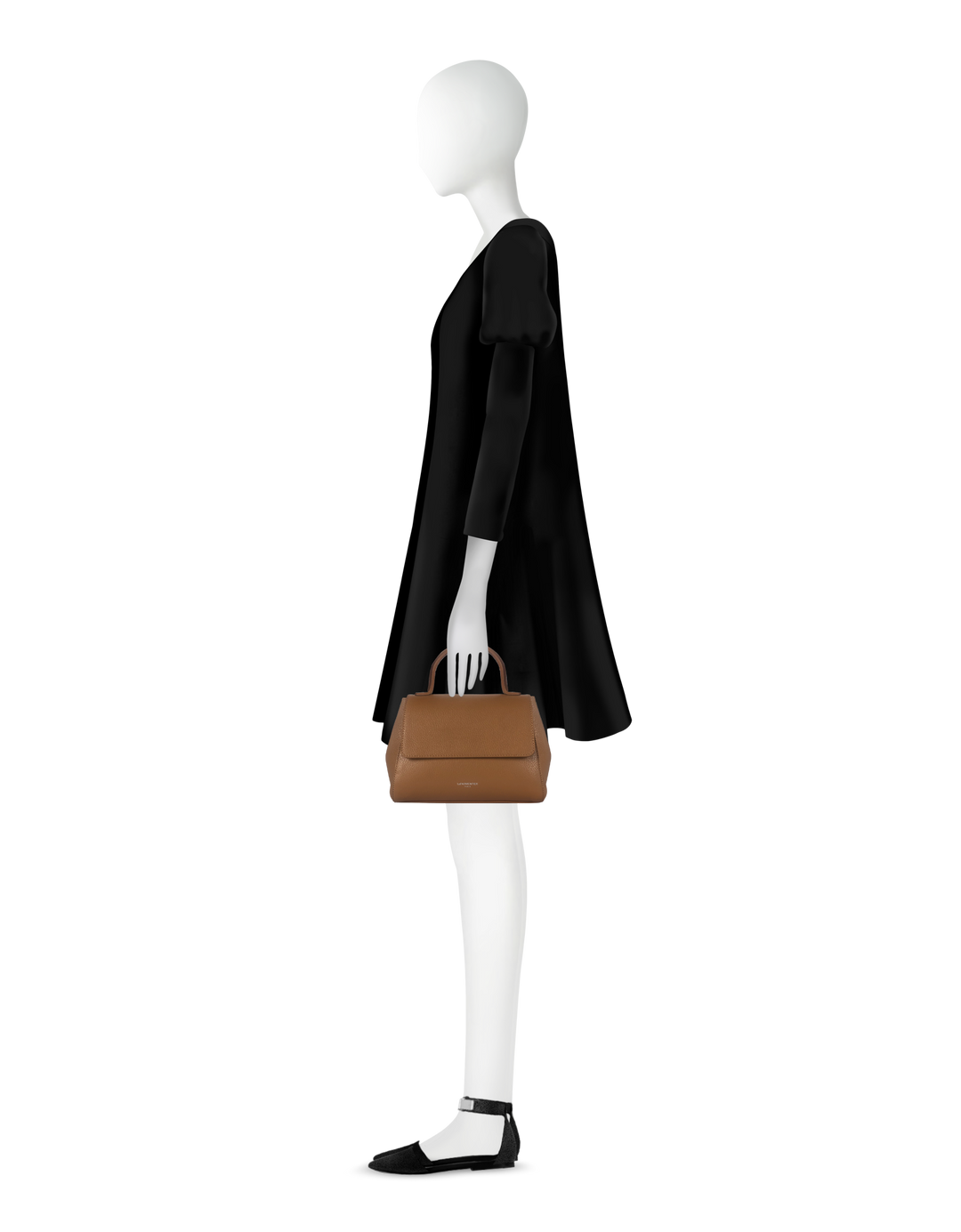 Elegant mannequin in black dress holding brown leather handbag