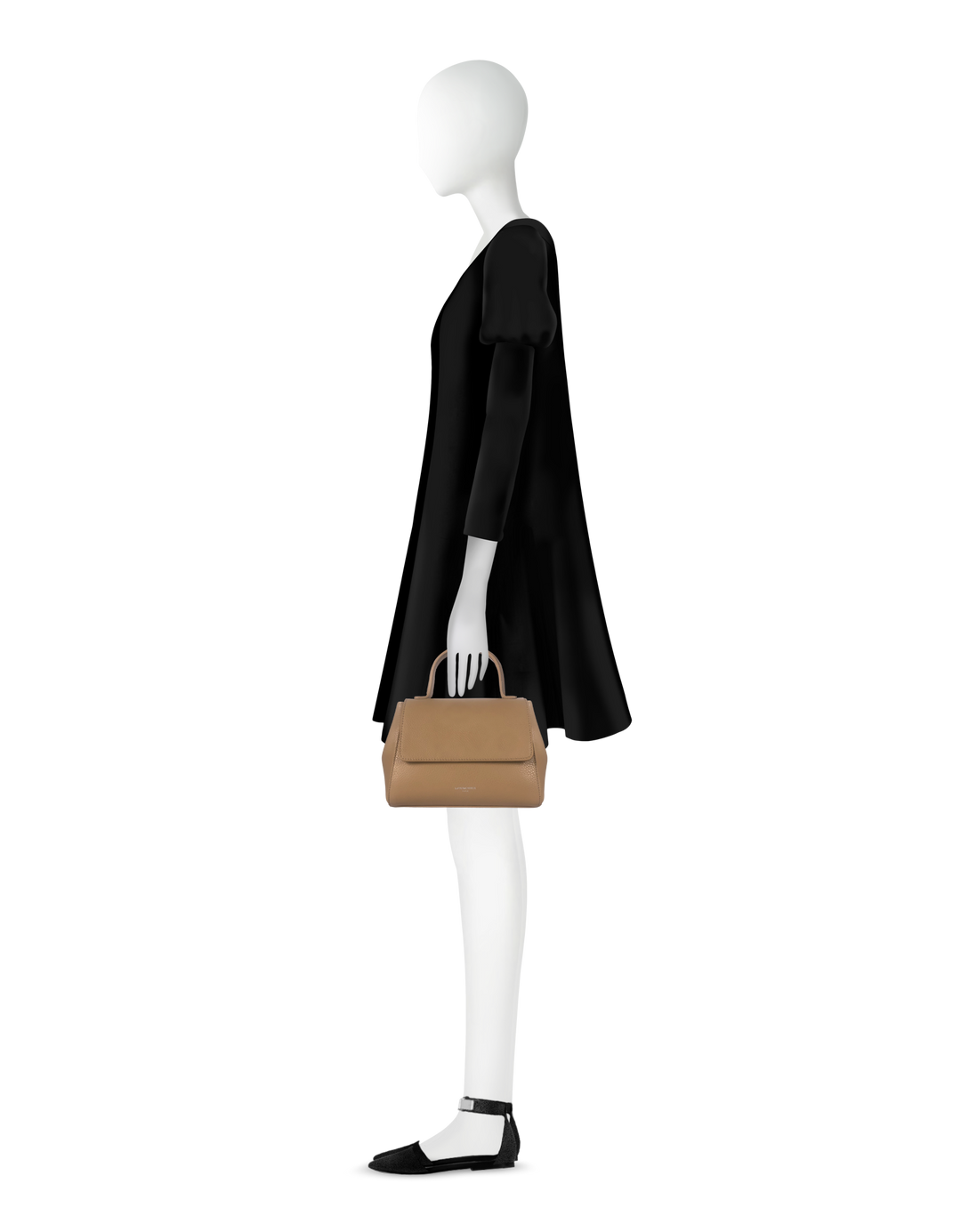 Side profile of mannequin wearing a black dress and holding a tan handbag