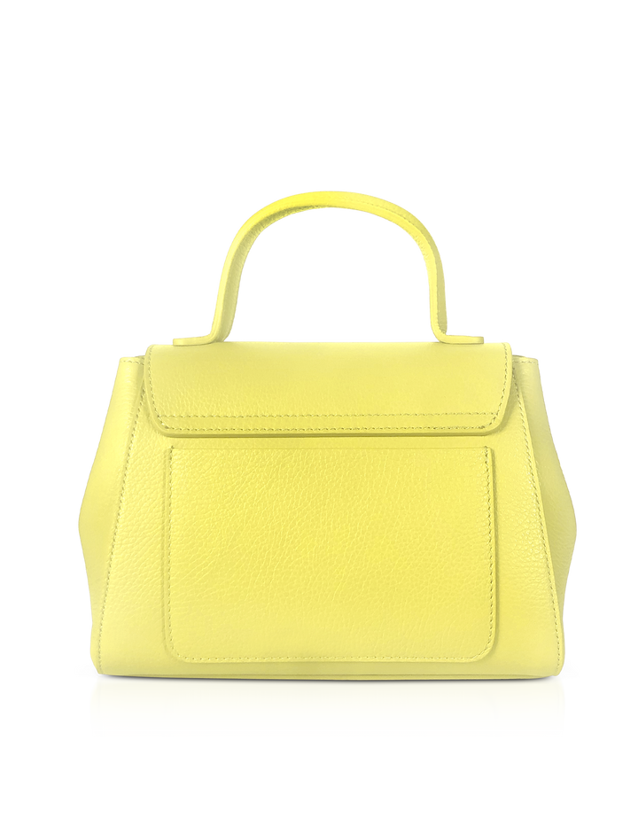 Yellow leather handbag with a top handle on a reflective surface