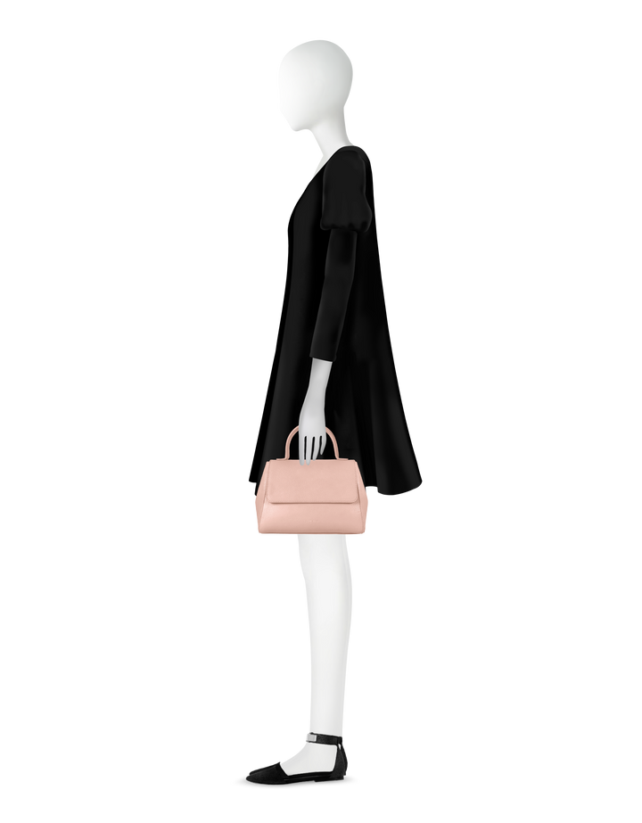 Fashion mannequin in black dress holding a pink handbag