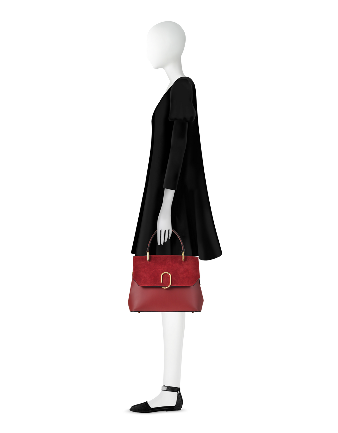 Fashion mannequin in black dress holding a stylish red handbag with gold accents