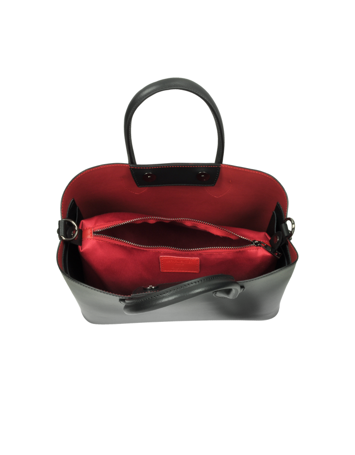 Black leather handbag with red interior and open top view showing inner zippered pocket