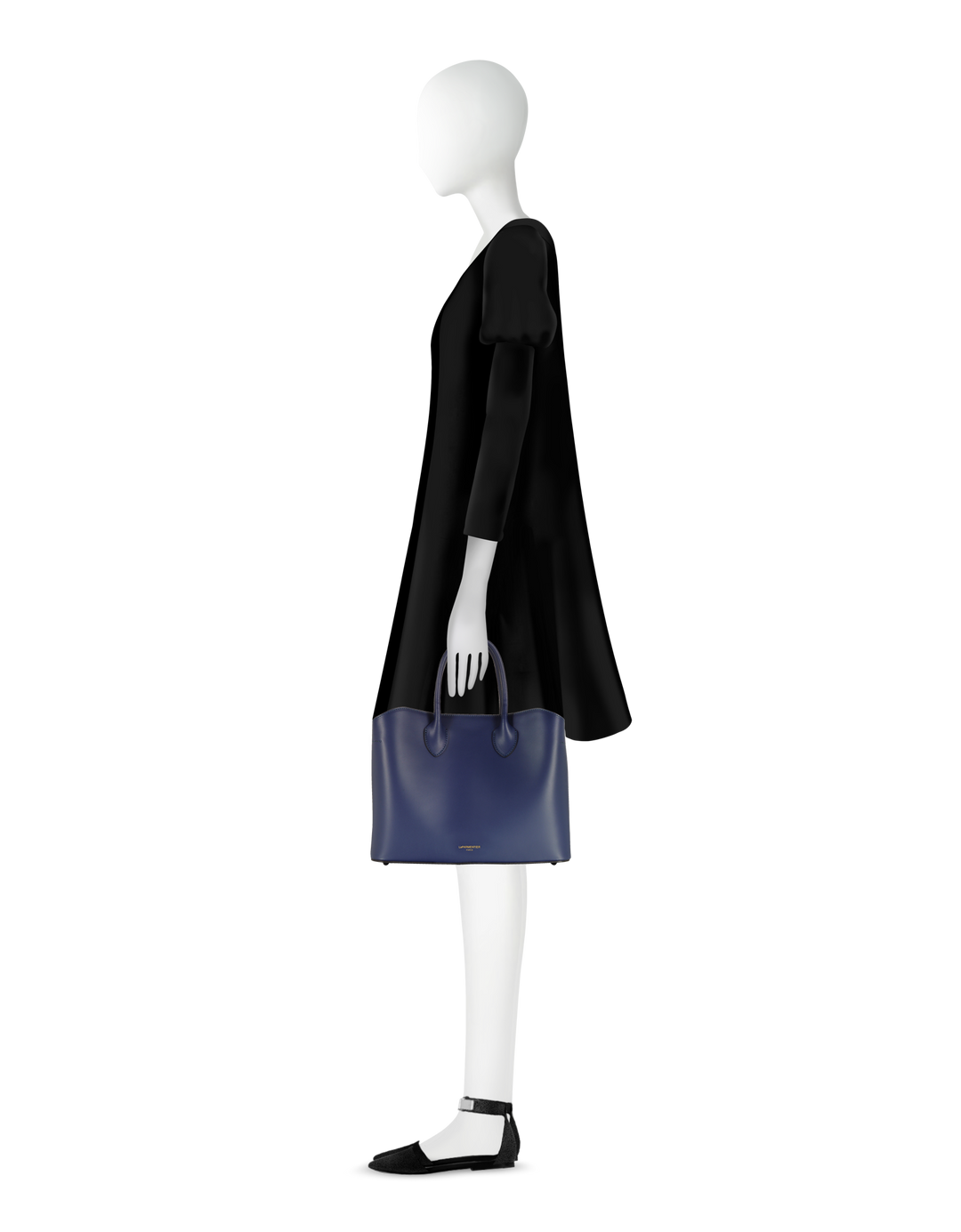 Side view of mannequin in black dress holding a blue designer handbag