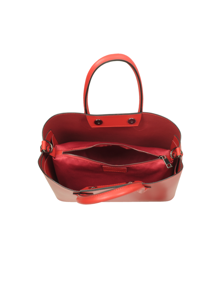 Red leather handbag with open top, showing inner compartments and zipper pocket