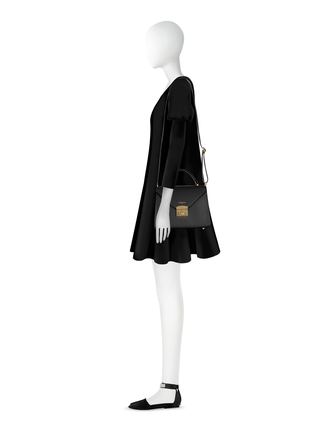 Fashion mannequin in black dress with matching handbag and shoes